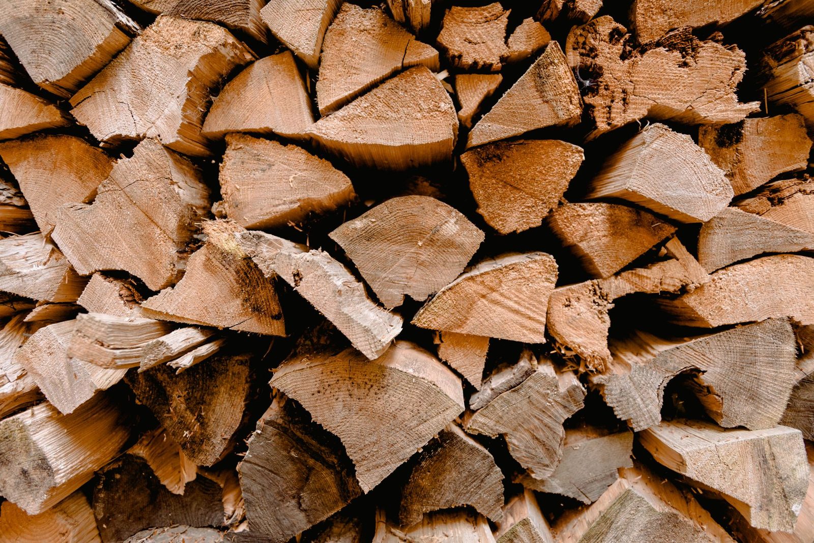 A neatly stacked pile of split firewood ready for winter