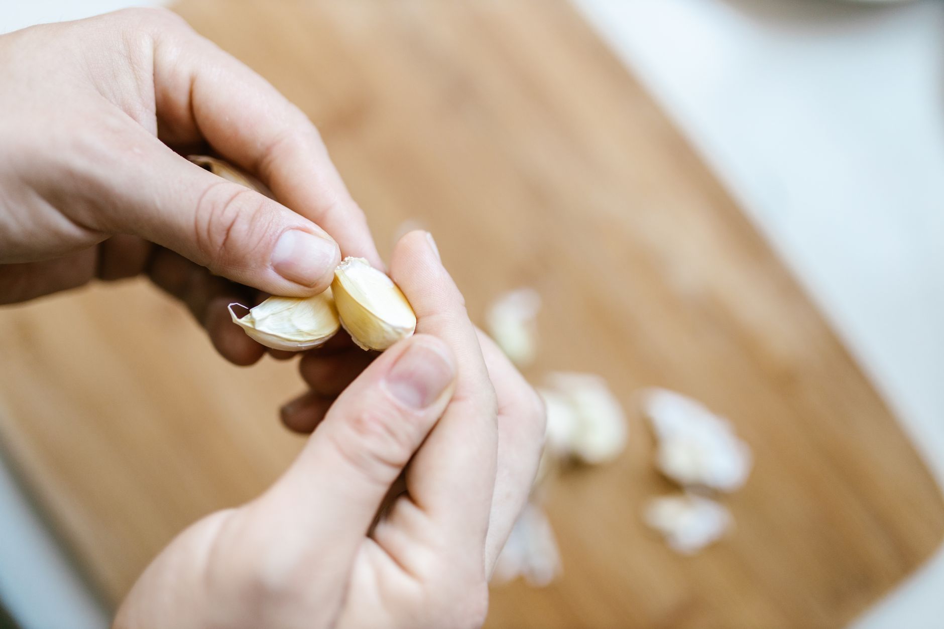 Planting garlic cloves in a garden bed in fall