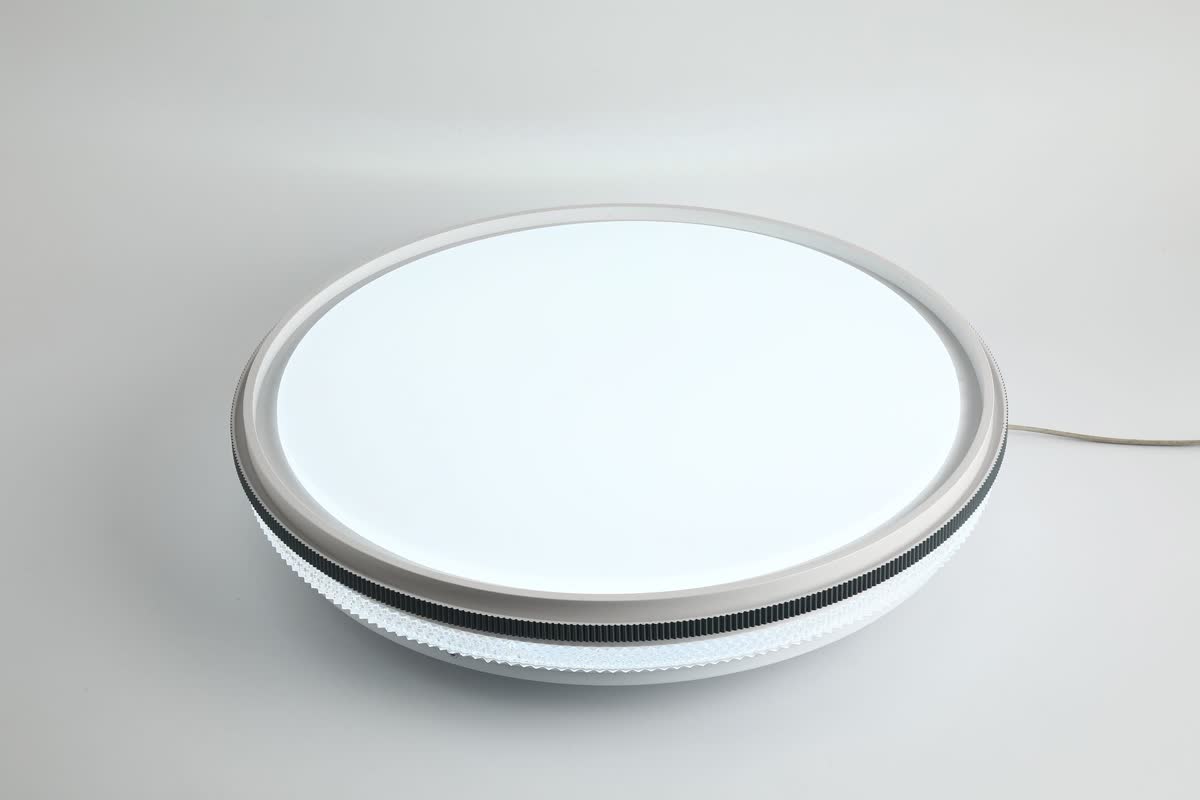 Une petite lumière tactile adhésive et ronde