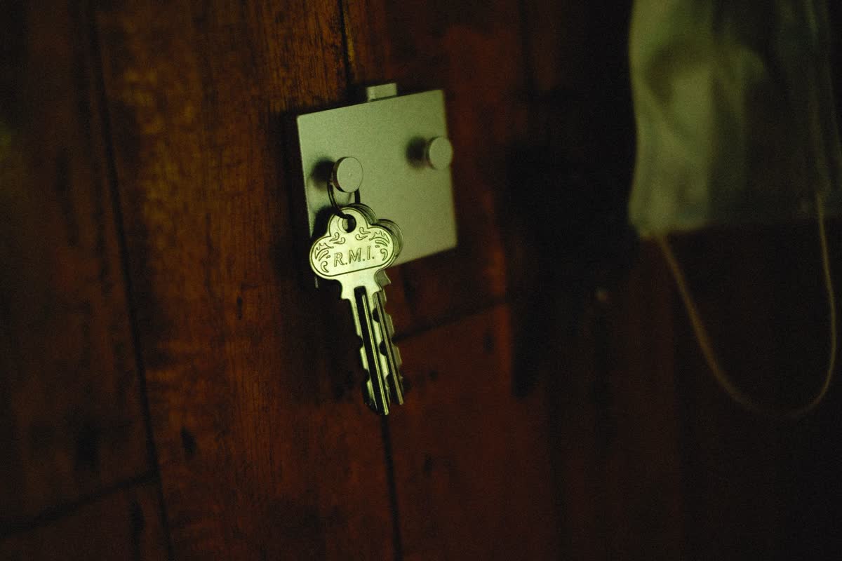 Keys hanging on a wall-mounted key holder