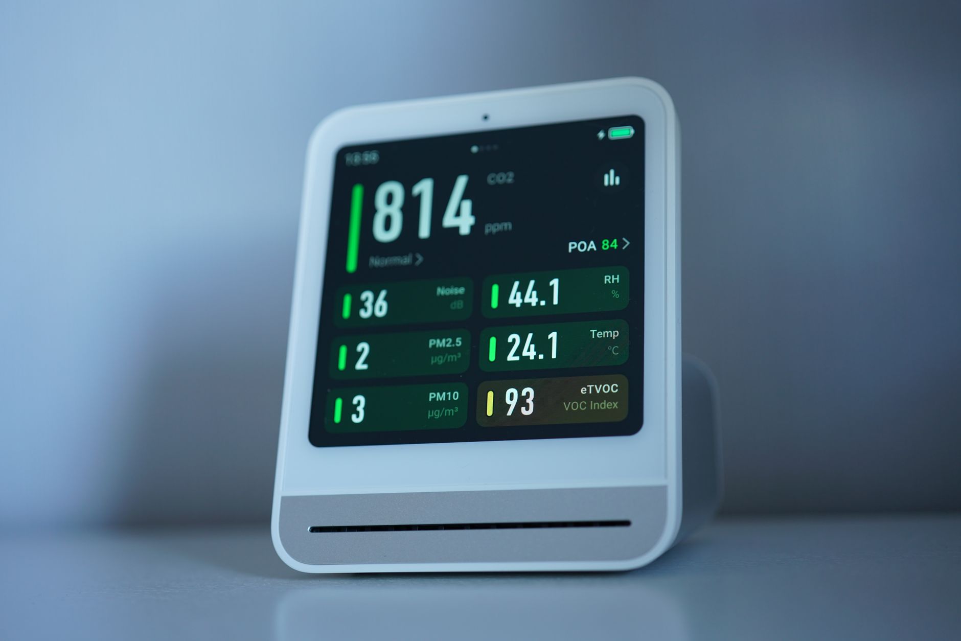 An indoor air-quality monitor showing readings