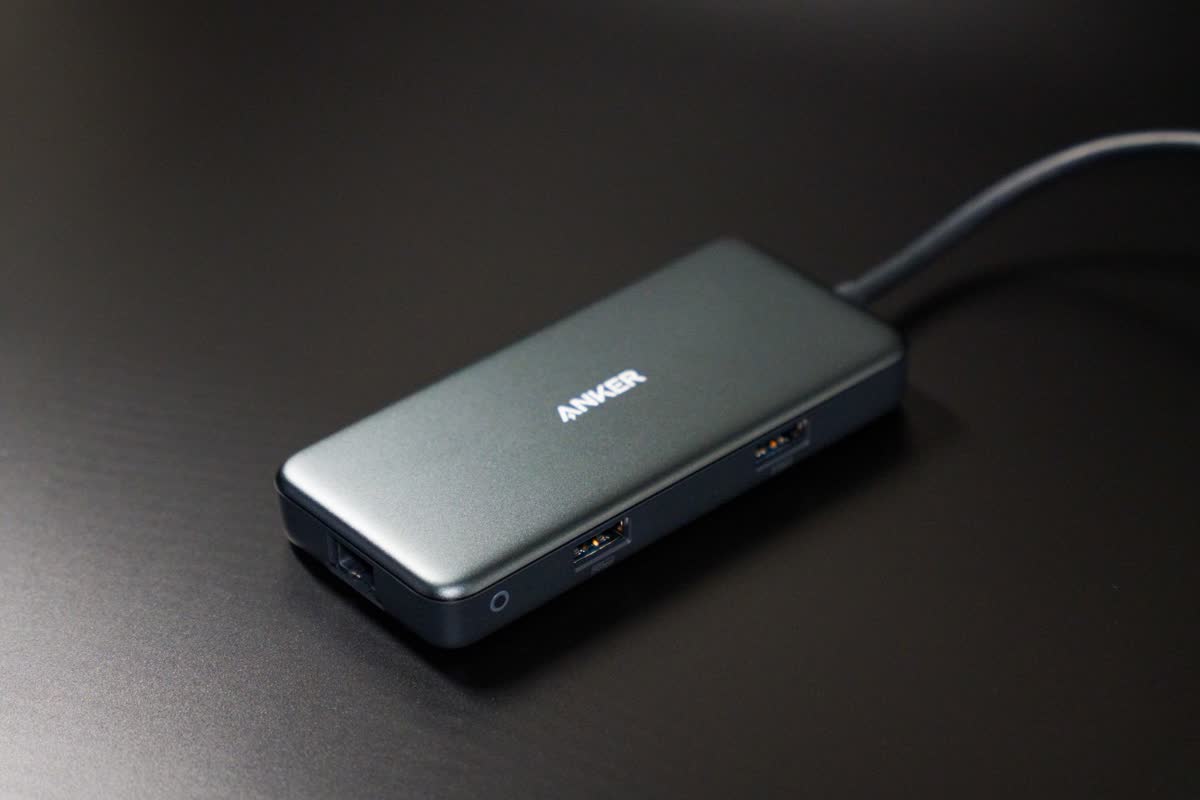A compact laptop docking station on a desk