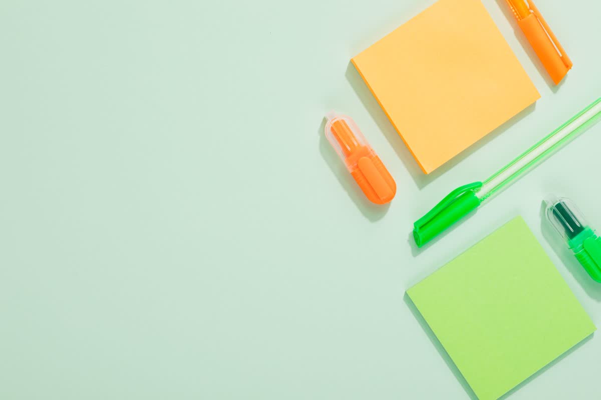 Colorful back-to-school supplies laid out on a desk