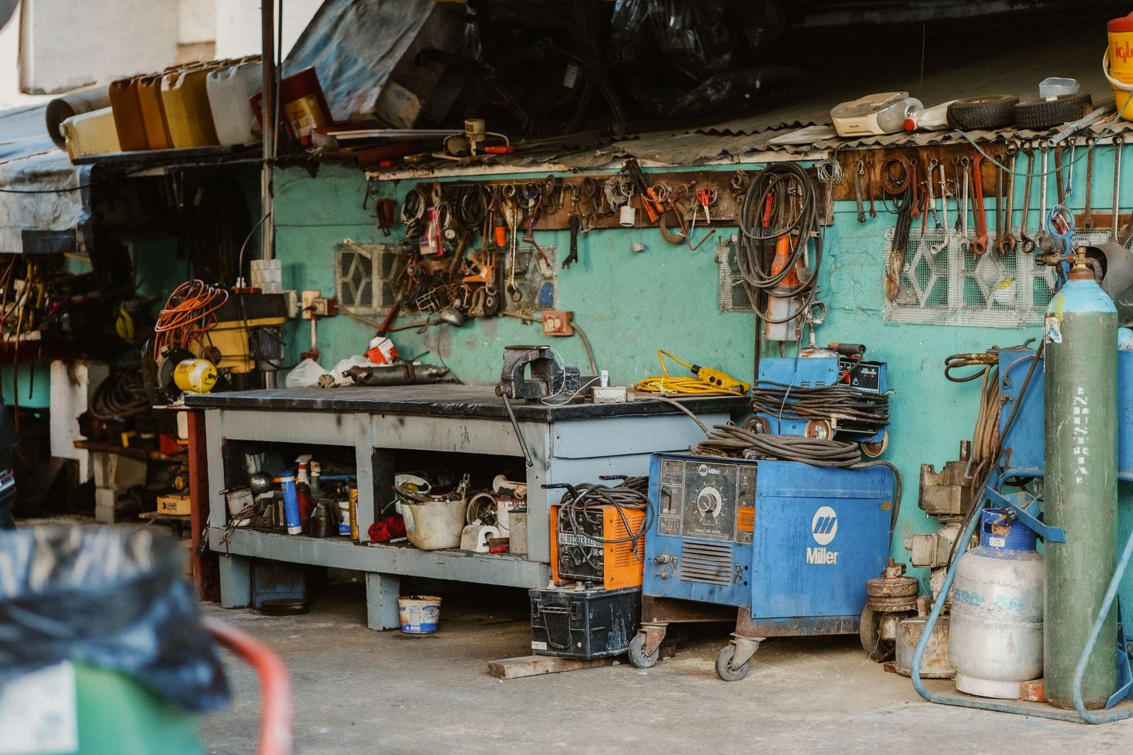 A well-equipped garage workbench full of tools